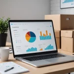 Modern e-commerce workspace with a laptop showing growth charts and shipping boxes, symbolizing a scaling small online shop.