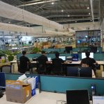 A professional warehouse workspace showing efficient order fulfillment for a real business